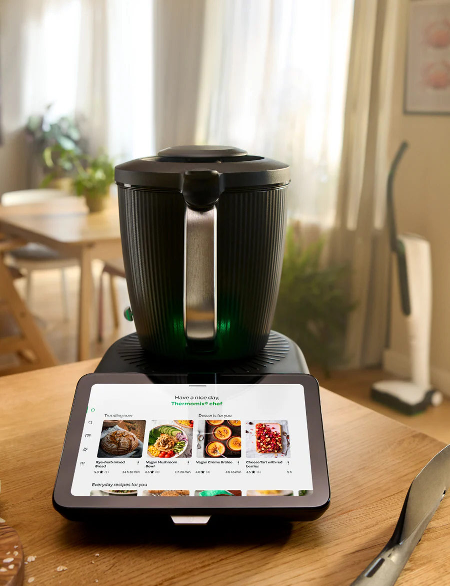 Thermomix® TM7™  - Cooking Robot on a wooden table.