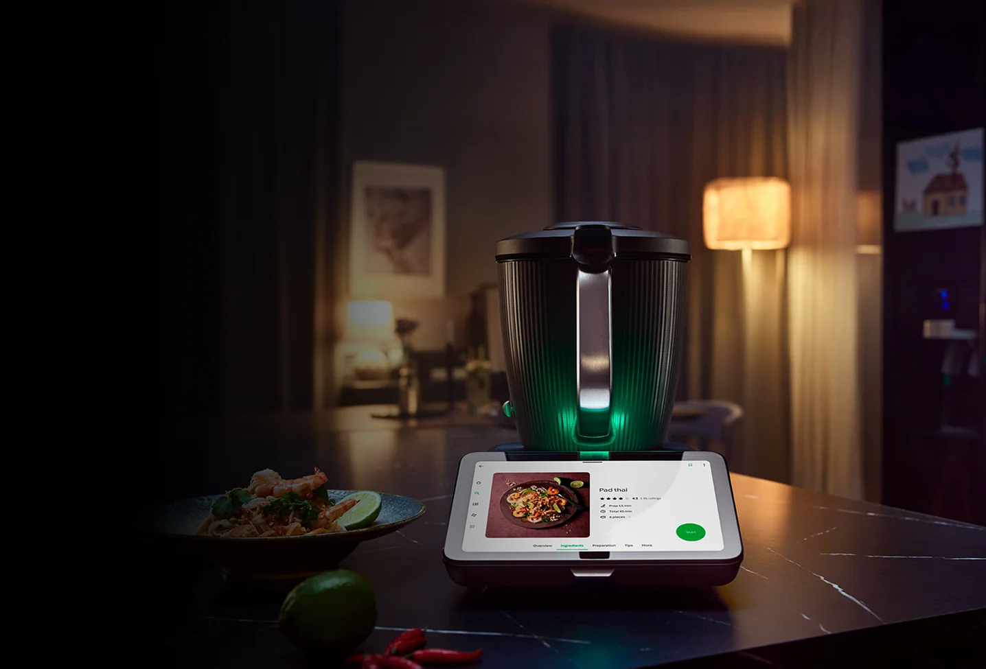 Smart cooking robot on a table in a dimly lit room.